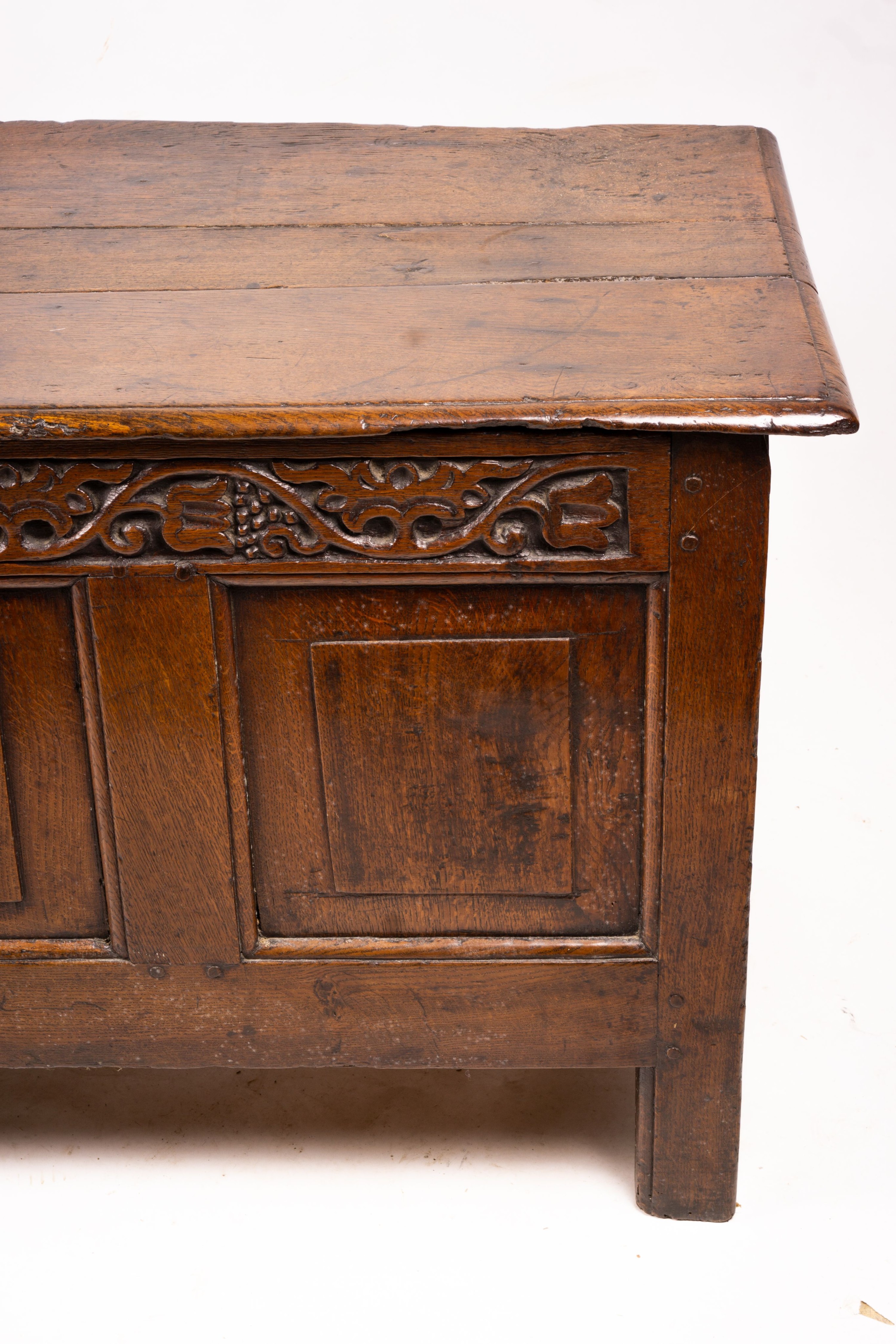 A 17th / 18th century carved oak coffer, length 132cm, depth 53cm, height 64cm